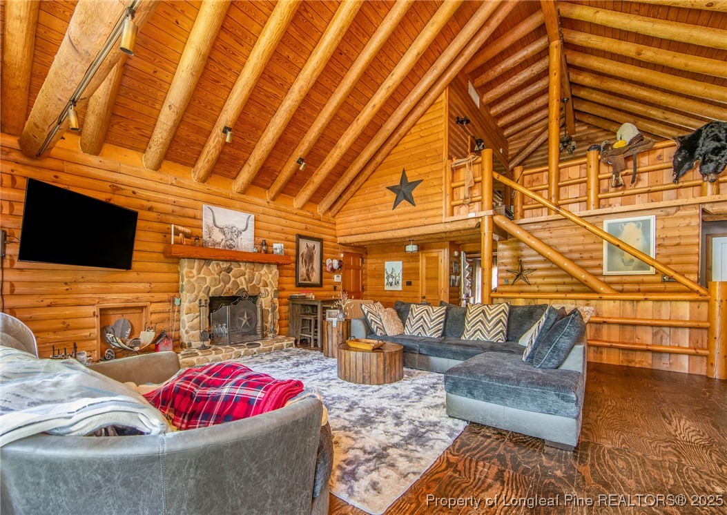 329 Silver Grove Church Road Rockingham, NC 28379 - Photo 15 of 36 a living room with furniture and a flat screen tv