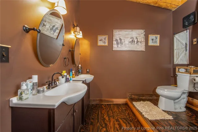 a white bath tub sitting next to a toilet