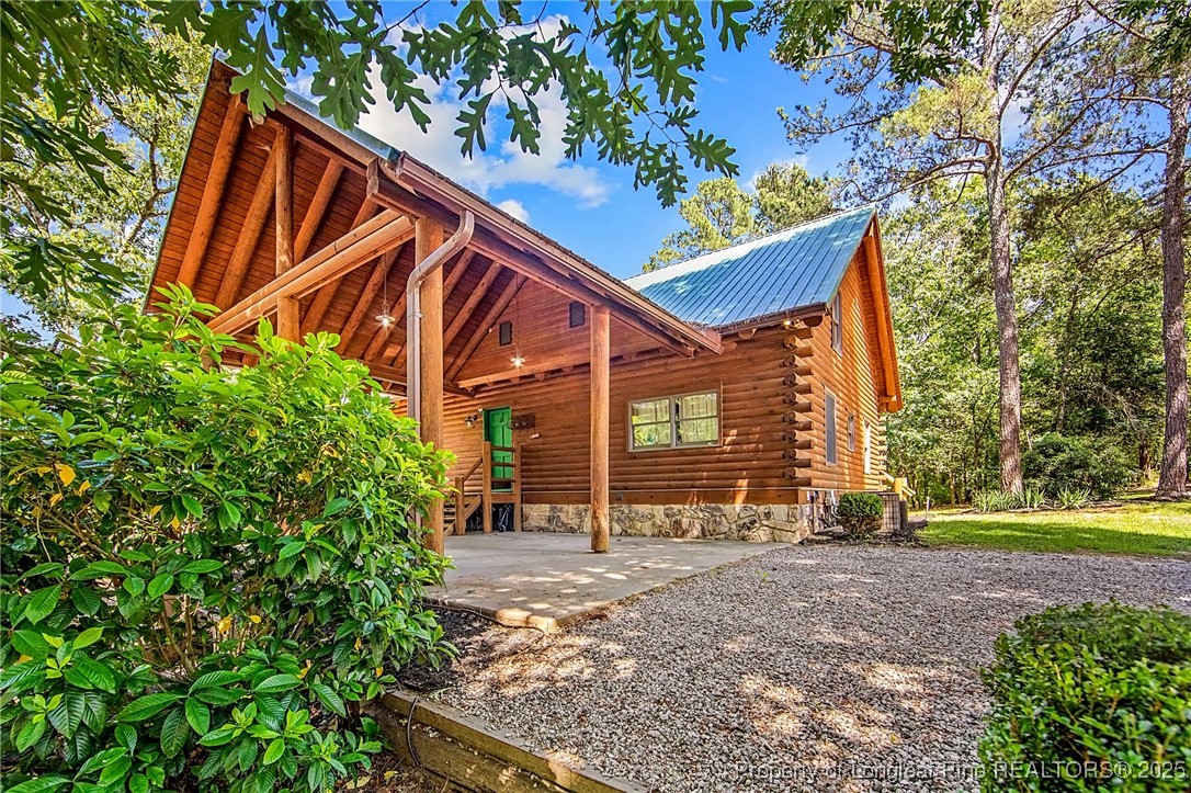 329 Silver Grove Church Road Rockingham, NC 28379 - Photo 27 of 36 front view of a house with a yard