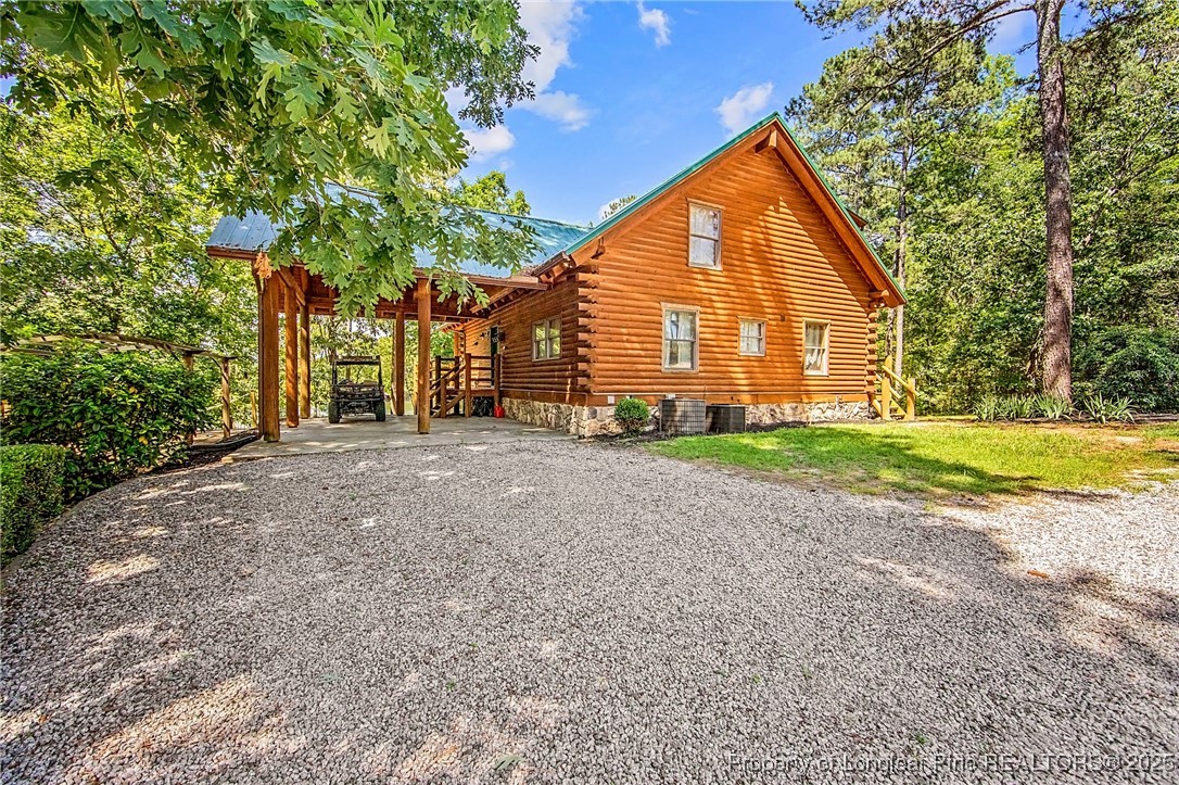 329 Silver Grove Church Road Rockingham, NC 28379 - Photo 29 of 36 a view of a house with backyard and trees