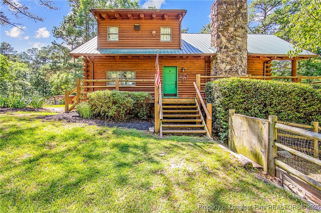 329 Silver Grove Church Road Rockingham, NC 28379 - Photo 32 of 36 a view of a house with backyard and plants