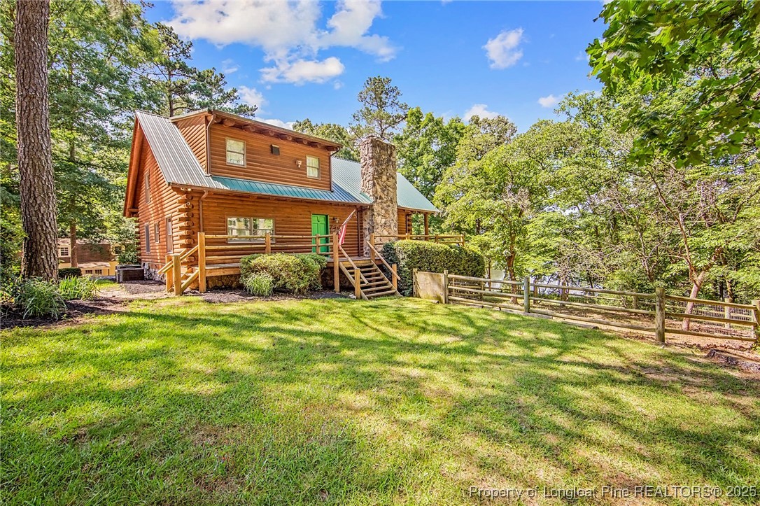 329 Silver Grove Church Road Rockingham, NC 28379 - Photo 33 of 36 a front view of a house with a garden
