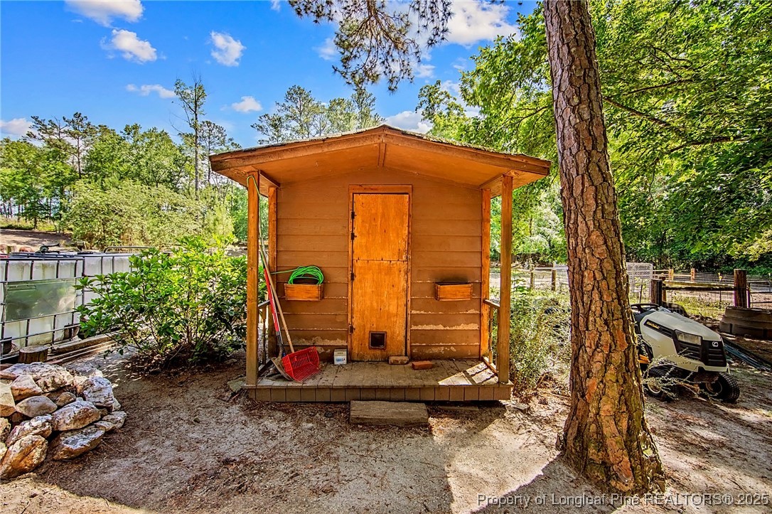 329 Silver Grove Church Road Rockingham, NC 28379 - Photo 9 of 36 a backyard of a house with barbeque oven