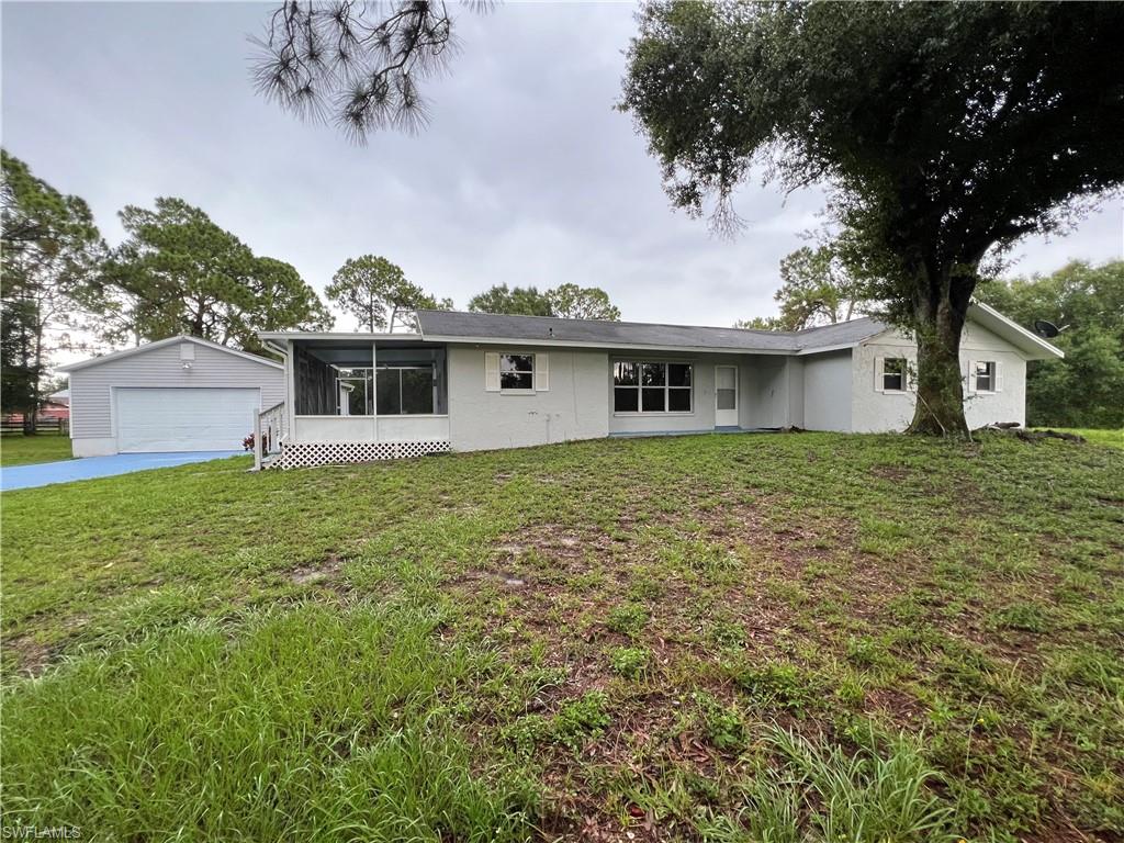 15290 Cemetery Road Fort Myers, FL 33905 - Photo 2 of 13 a house view with a garden space