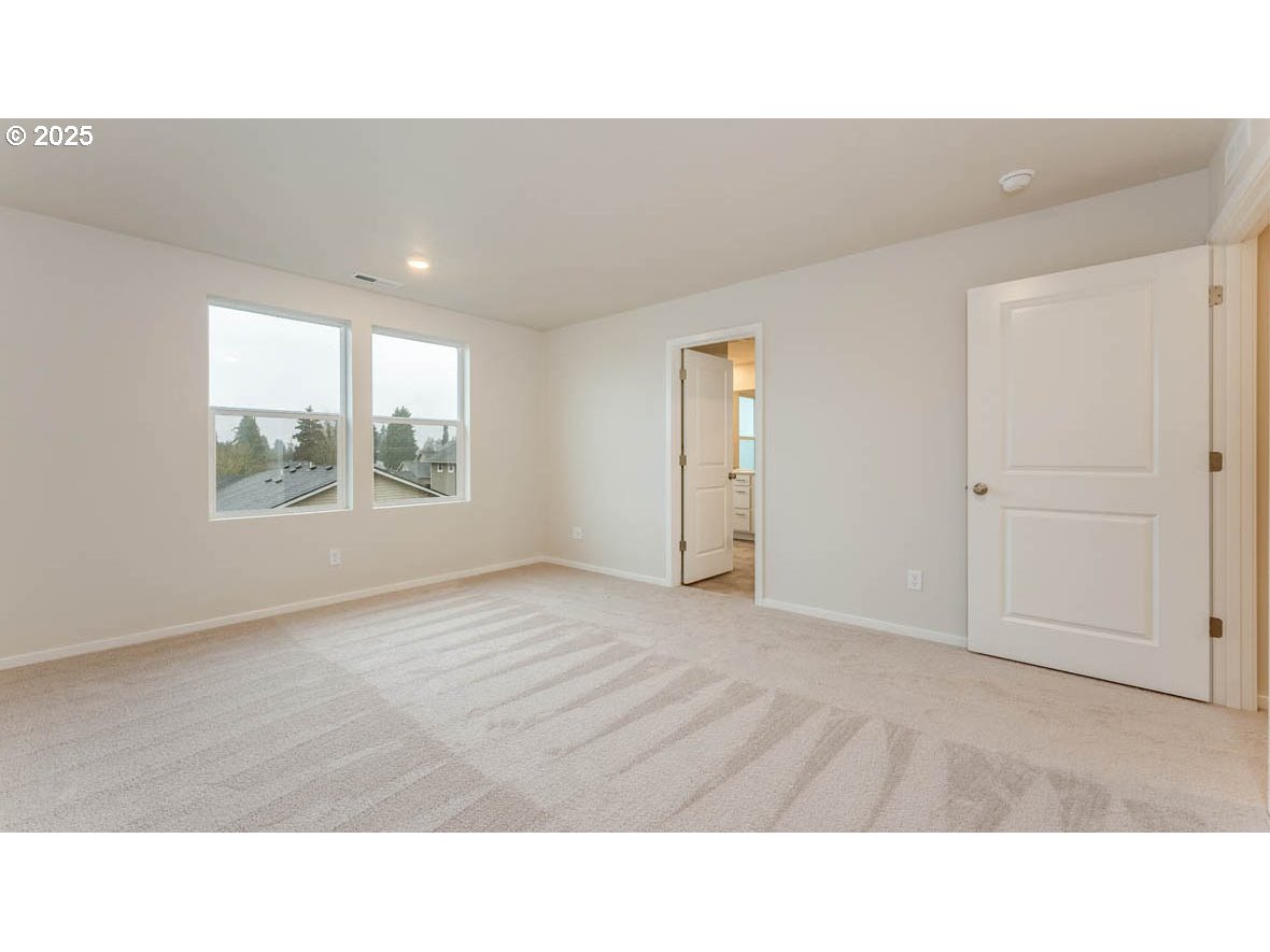 2315 30th Place Springfield, OR 97477 - Photo 22 of 27 a open hall with wooden floor and windows