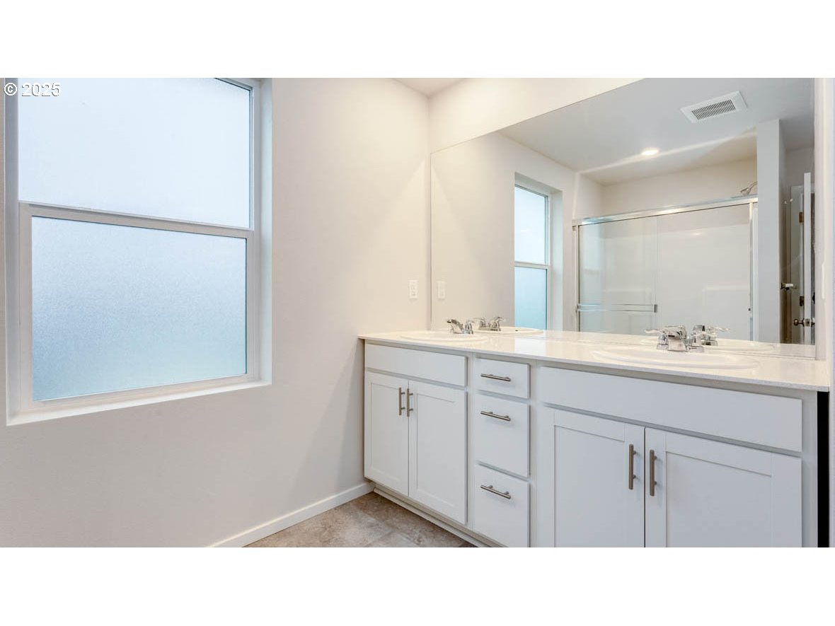 2315 30th Place Springfield, OR 97477 - Photo 24 of 27 a bathroom with a sink a mirror and a vanity