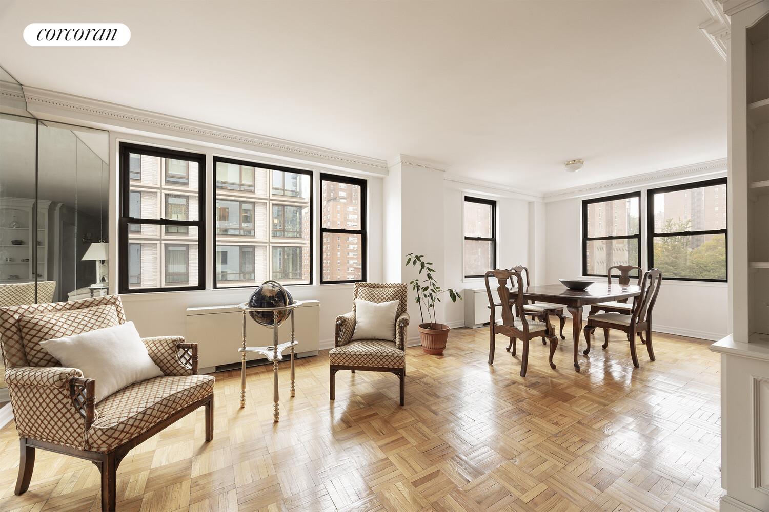 201 East 21st Street, Unit 7S Manhattan, NY 10010 - Photo 1 of 12 a living room with furniture and a large window