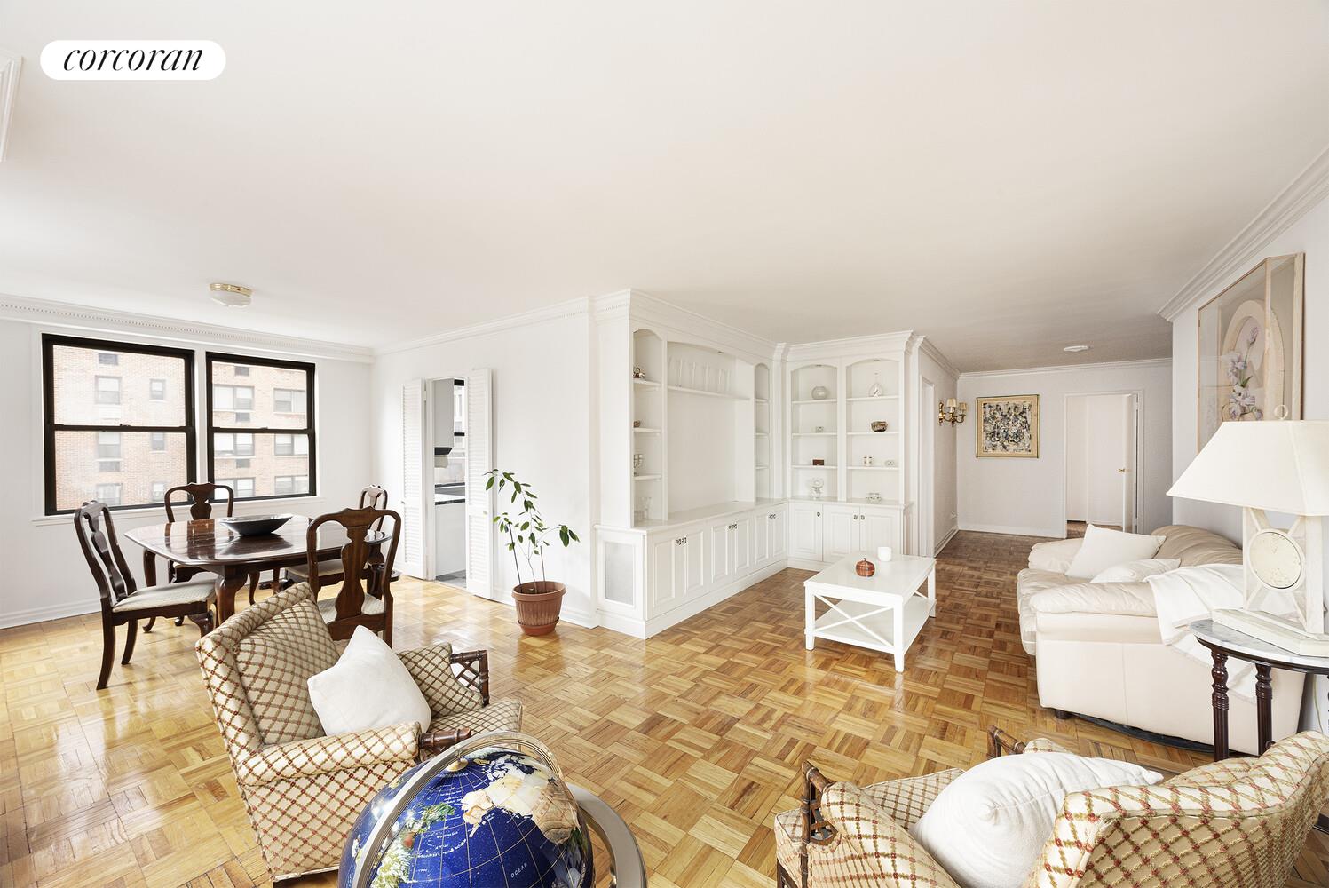 201 East 21st Street, Unit 7S Manhattan, NY 10010 - Photo 2 of 12 a living room with furniture and wooden floor