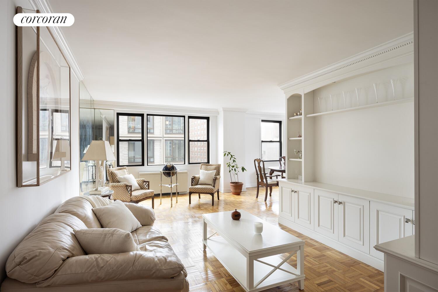 201 East 21st Street, Unit 7S Manhattan, NY 10010 - Photo 3 of 12 a living room with furniture and a large window