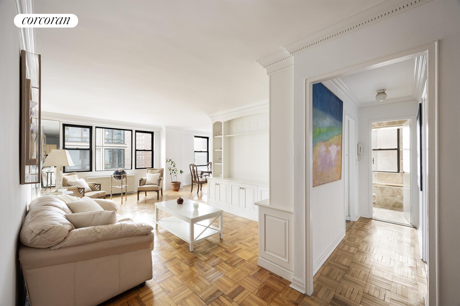 201 East 21st Street, Unit 7S Manhattan, NY 10010 - Photo 7 of 12 a living room with furniture and a large window
