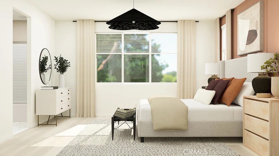 24812 Sirius Avenue Moreno Valley, CA 92551 - Photo 12 of 16 a bedroom with furniture and a large window