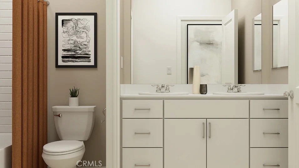 24812 Sirius Avenue Moreno Valley, CA 92551 - Photo 8 of 16 a bathroom with a toilet a sink and mirror