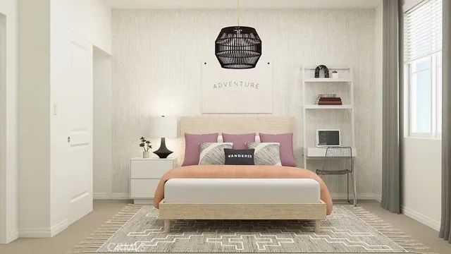 a bedroom with a large bed and a window