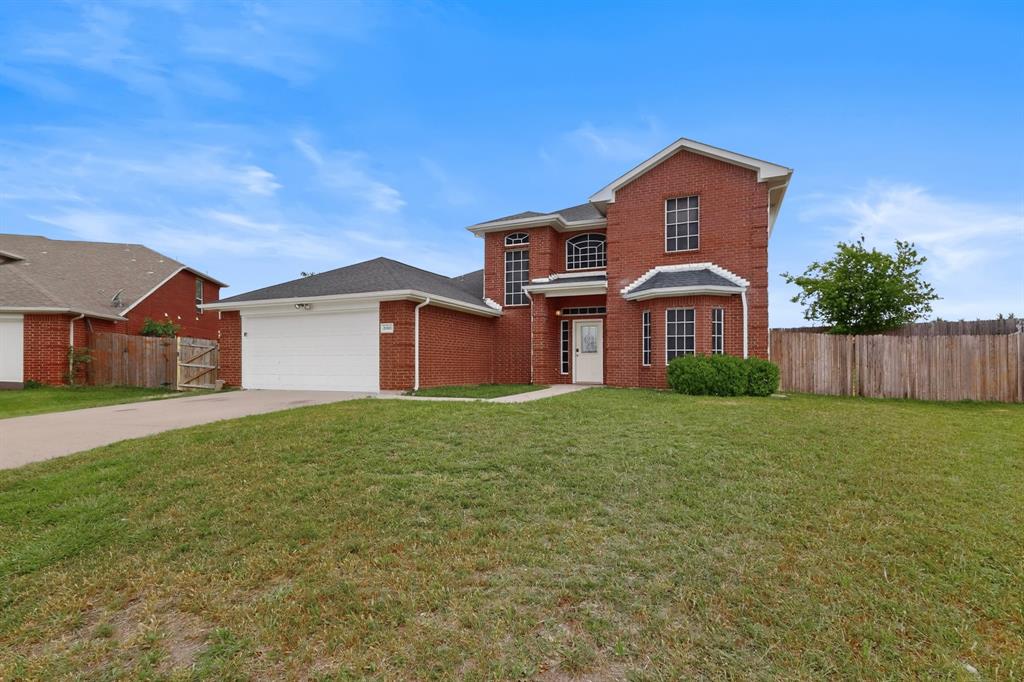 3401 Newgate Street Midlothian, TX 76065 - Photo 2 of 34 Brick exterior featuring a two-car garage, established front lawn, covered entry, and bay window