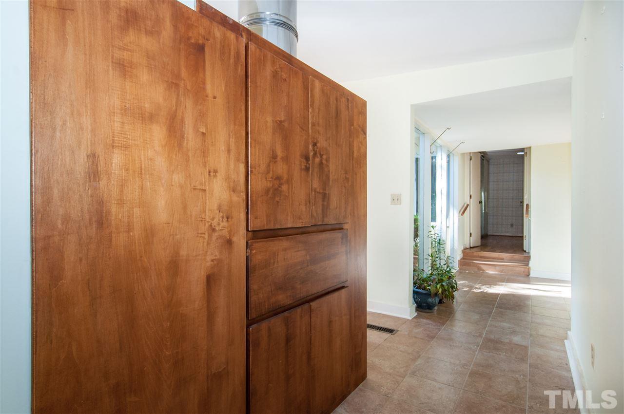2707 North Mayview Road Raleigh, NC 27607 - Photo 12 of 25 a view of a hallway with wooden shelves