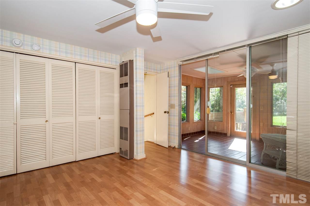 2707 North Mayview Road Raleigh, NC 27607 - Photo 14 of 25 an empty room with wooden floor and windows
