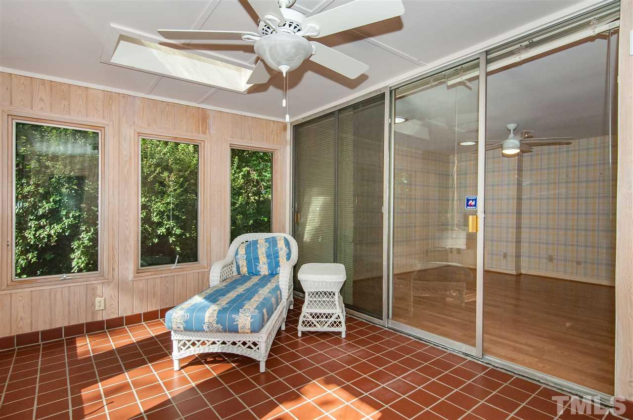 2707 North Mayview Road Raleigh, NC 27607 - Photo 16 of 25 a bathroom with a mirror and a glass shower door