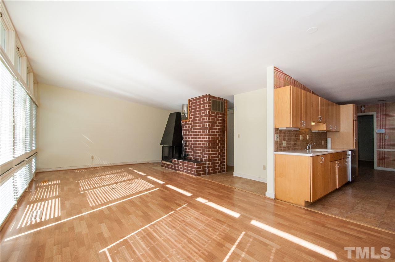 2707 North Mayview Road Raleigh, NC 27607 - Photo 8 of 25 a view of a kitchen with furniture and an empty room
