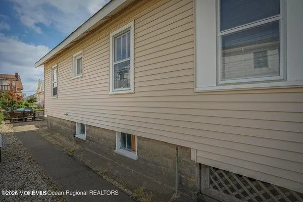 a living room with furniture a rug and a window