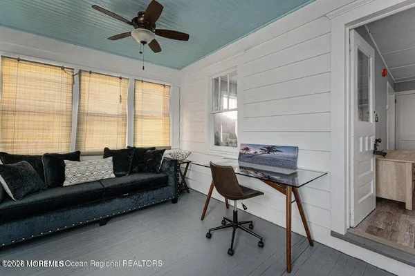 a living room with furniture and a window