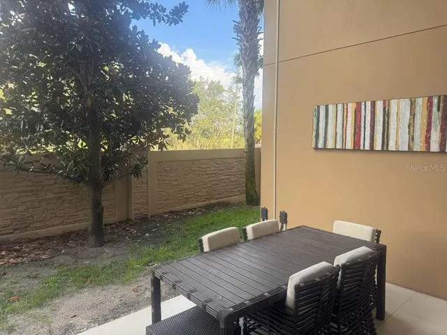 a bathroom with a granite countertop toilet sink and mirror