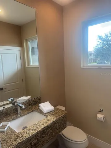 a bathroom with a shower and a window