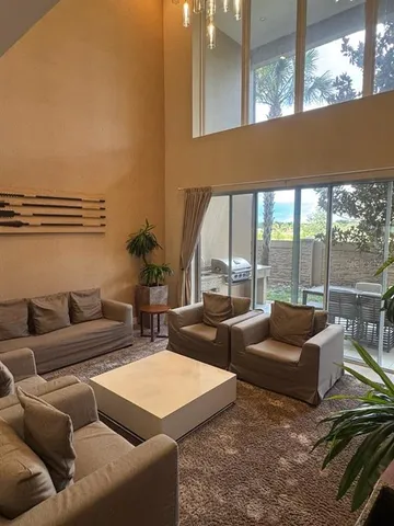 a living room with furniture and a couch