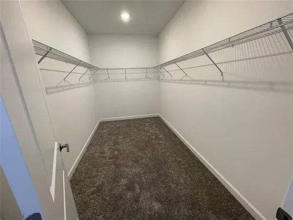 a view of a room with racks on the wall