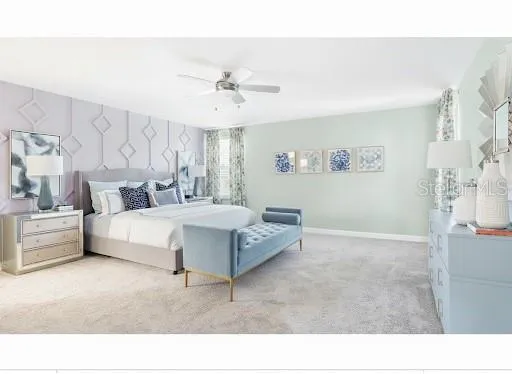 a spacious bedroom with a bed and a chandelier