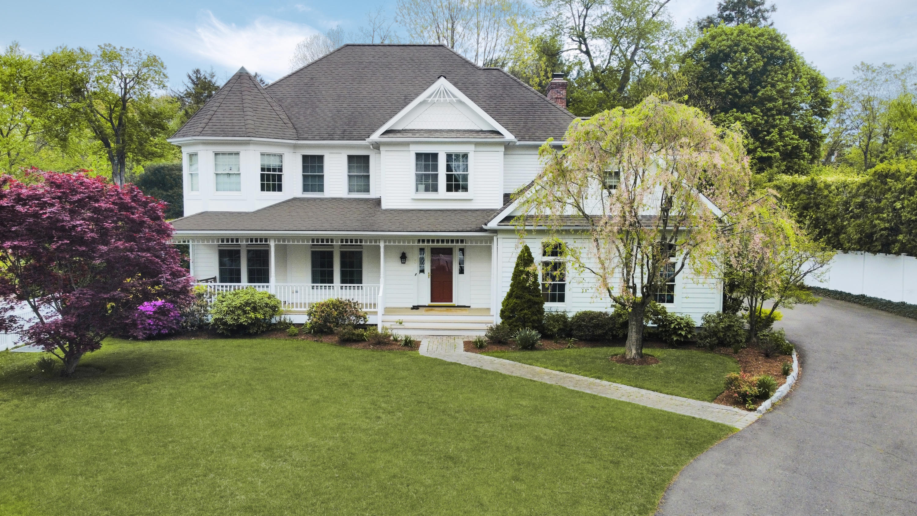 a front view of a house with garden