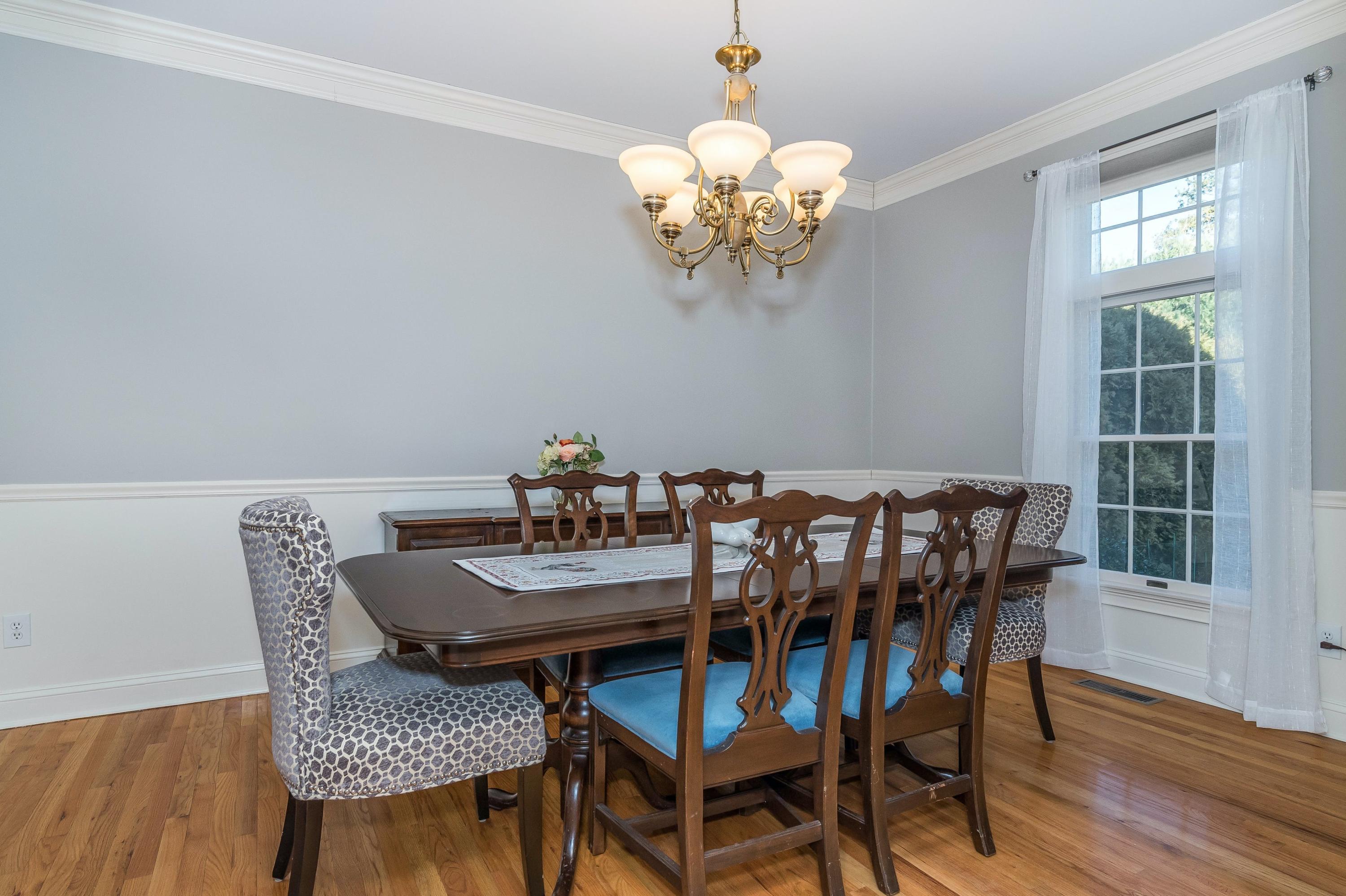 3 Fresh Meadows Lane Darien, CT 06820 - Photo 11 of 39 a view of a dining room with furniture wooden floor and chandelier