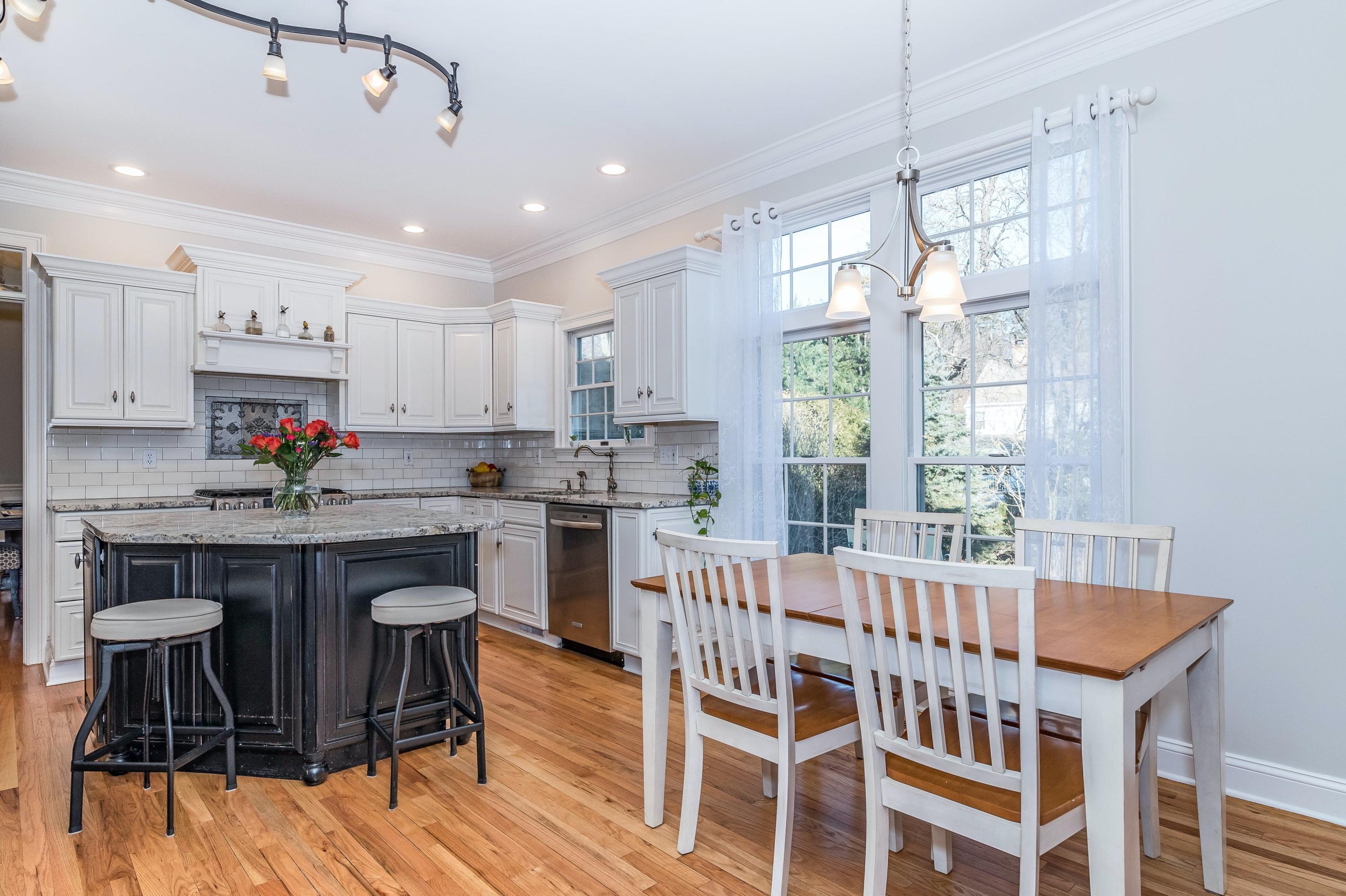 3 Fresh Meadows Lane Darien, CT 06820 - Photo 12 of 39 a kitchen that has a lot of cabinets in it with stainless steel appliances granite countertop a dining table chairs sink and cabinets