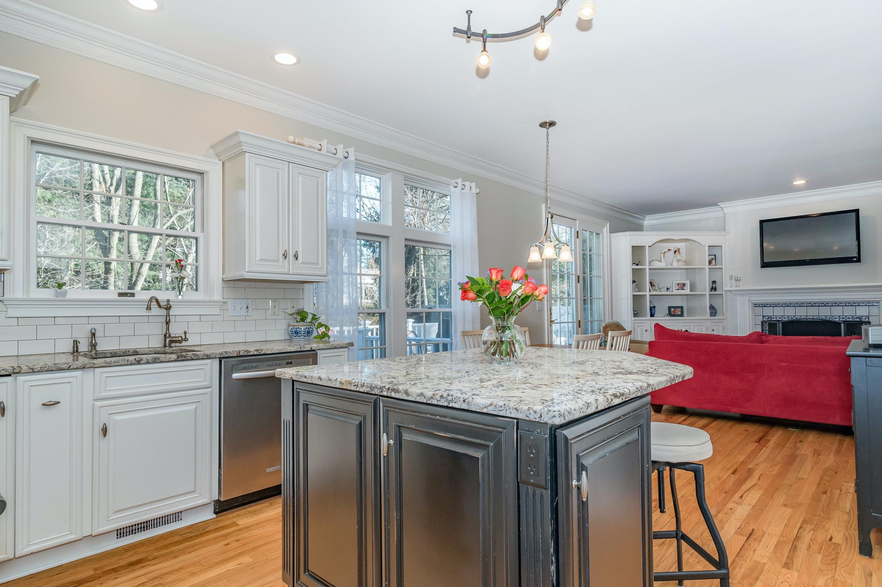 3 Fresh Meadows Lane Darien, CT 06820 - Photo 14 of 39 a kitchen with stainless steel appliances granite countertop a kitchen island hardwood floor sink stove and wooden cabinets
