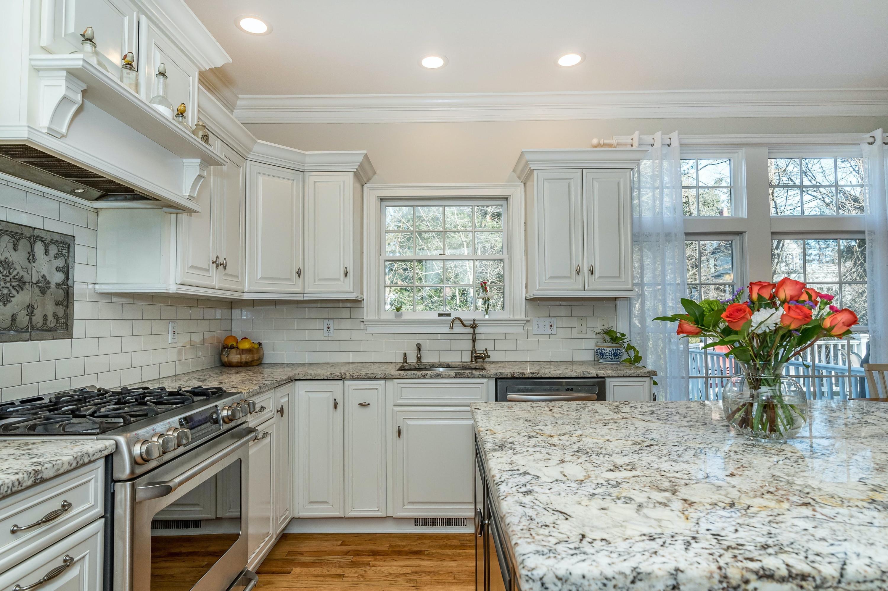 3 Fresh Meadows Lane Darien, CT 06820 - Photo 16 of 39 a kitchen with stainless steel appliances granite countertop a sink stove and cabinets