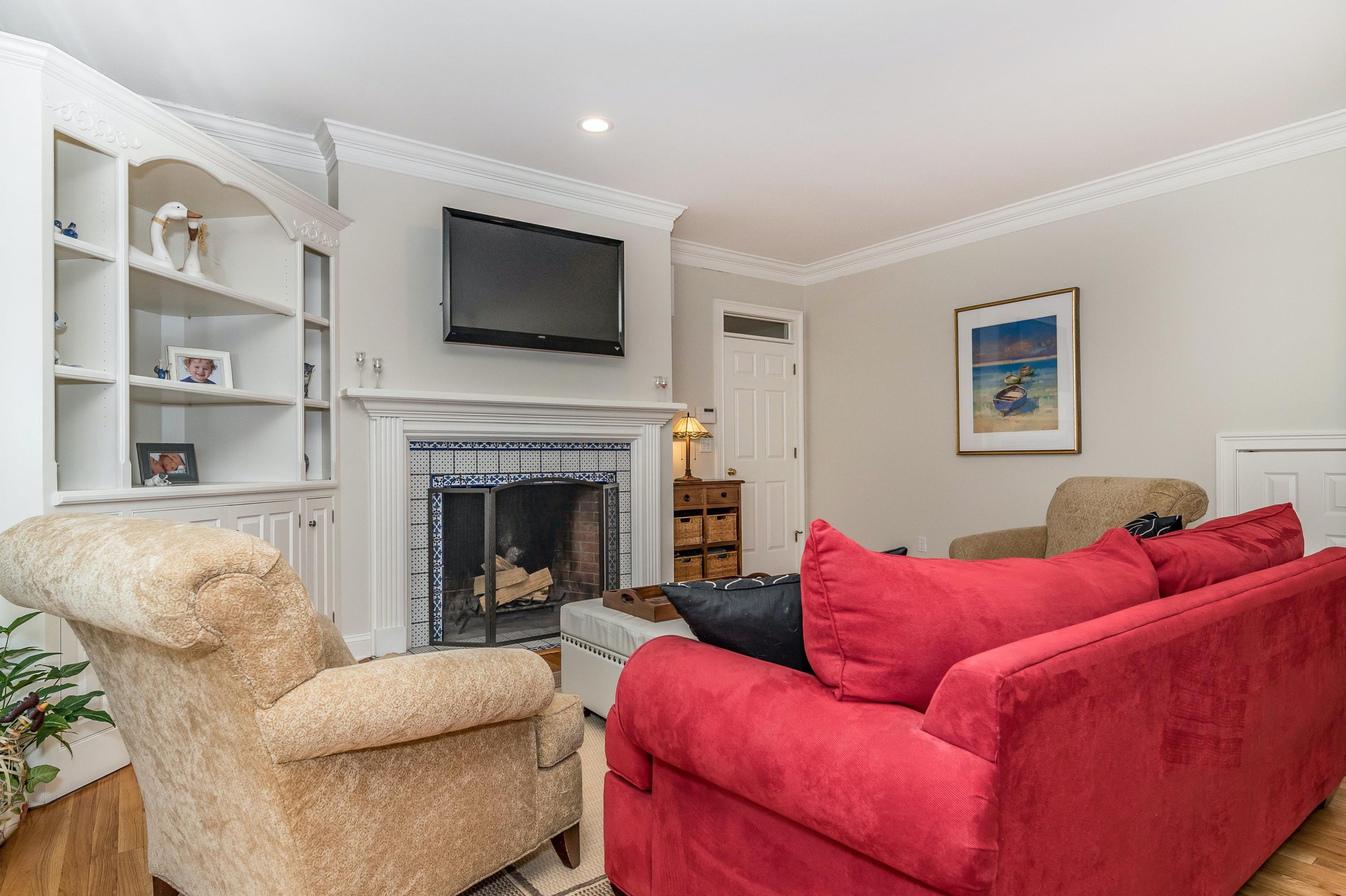 3 Fresh Meadows Lane Darien, CT 06820 - Photo 18 of 39 a living room with furniture or flat screen tv and a fireplace