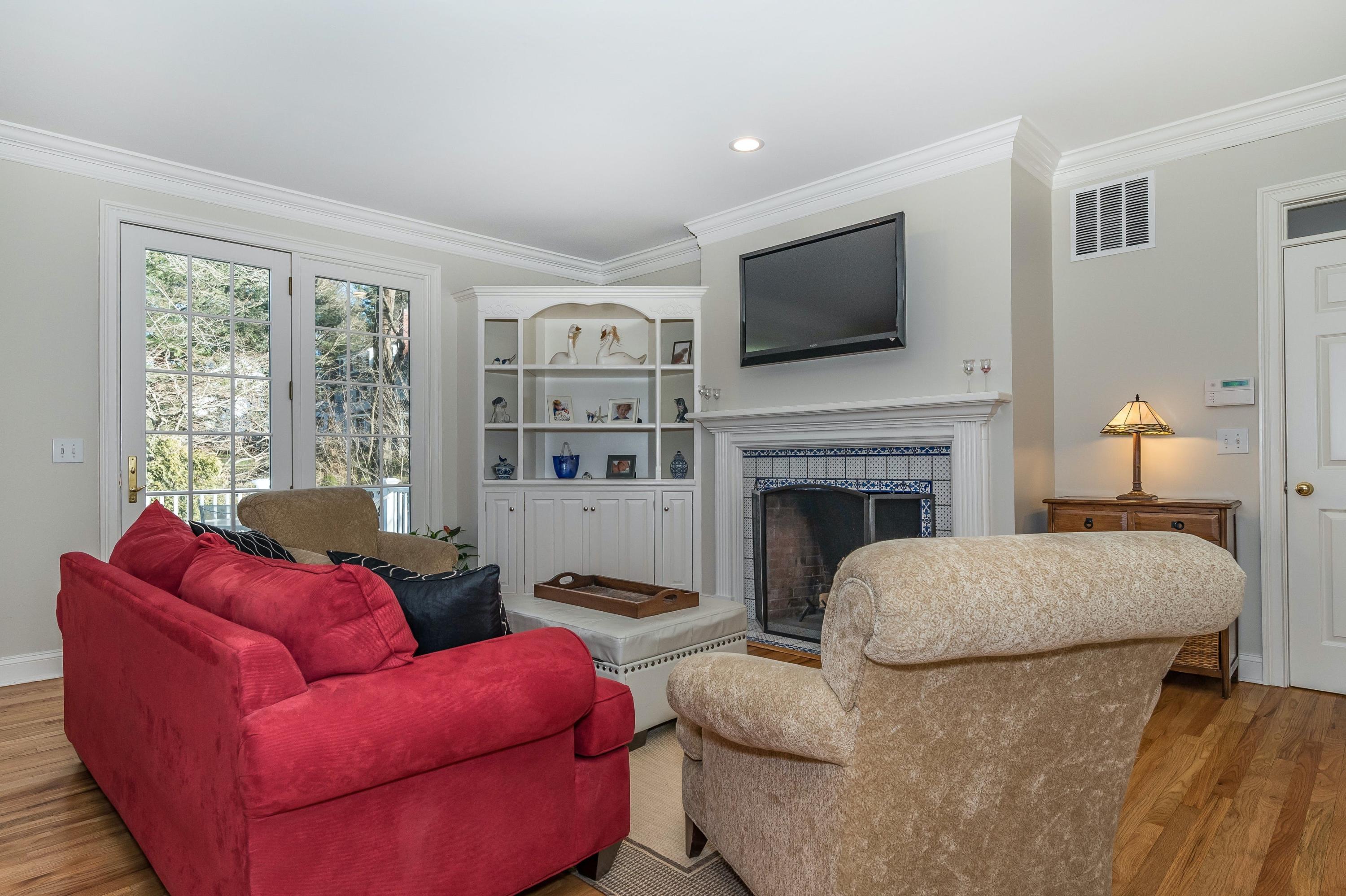 3 Fresh Meadows Lane Darien, CT 06820 - Photo 19 of 39 a living room with furniture fireplace and flat screen tv