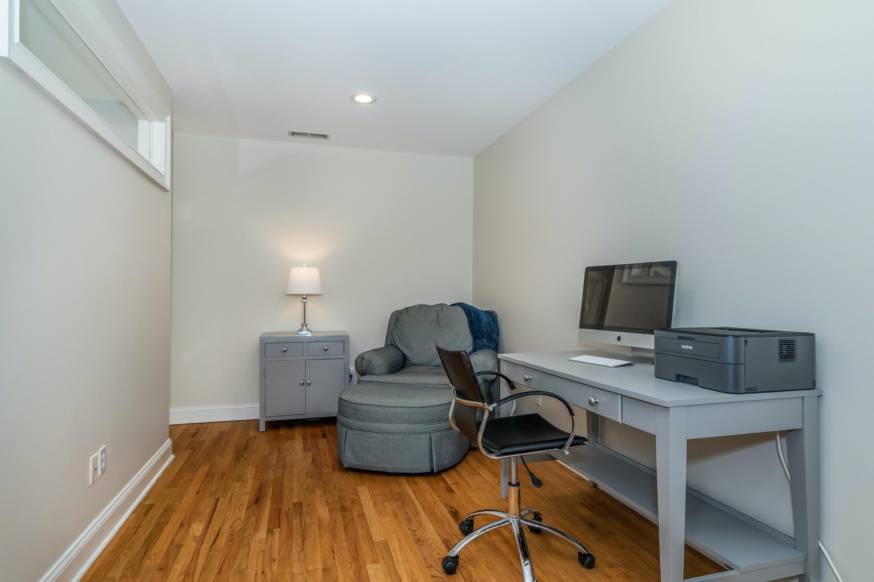 3 Fresh Meadows Lane Darien, CT 06820 - Photo 24 of 39 a workspace with furniture and wooden floor