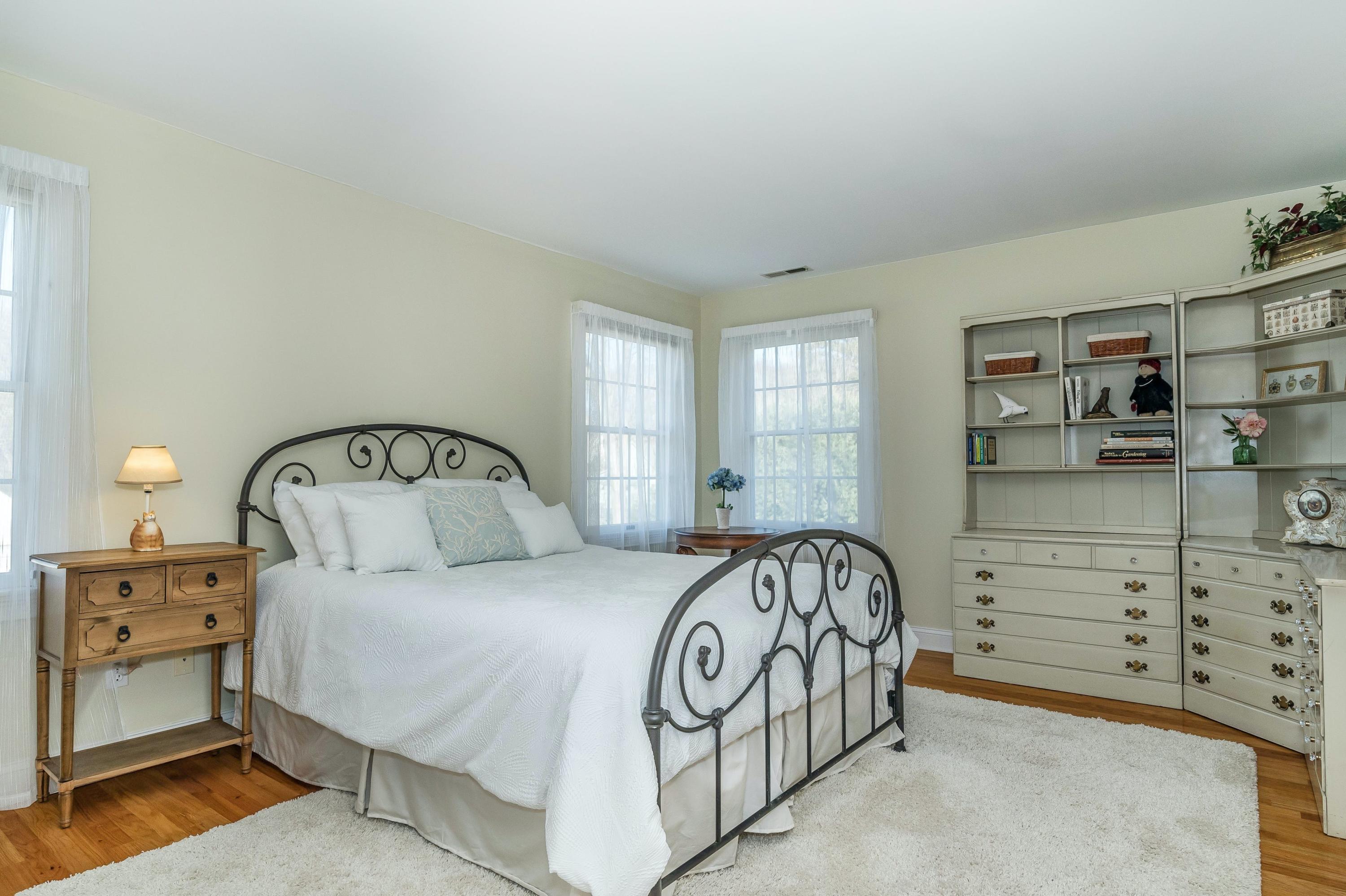 3 Fresh Meadows Lane Darien, CT 06820 - Photo 28 of 39 a bedroom with a bed and a window