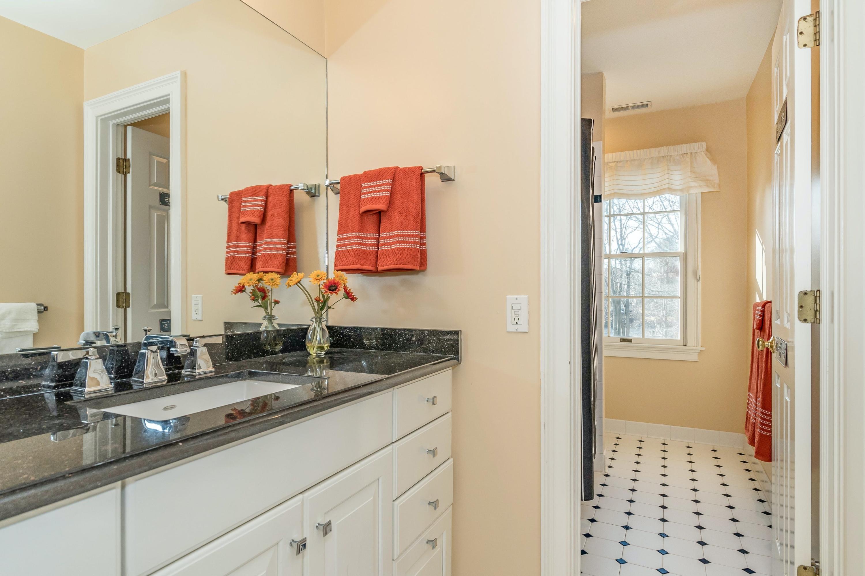 3 Fresh Meadows Lane Darien, CT 06820 - Photo 30 of 39 a bathroom with a sink and a mirror
