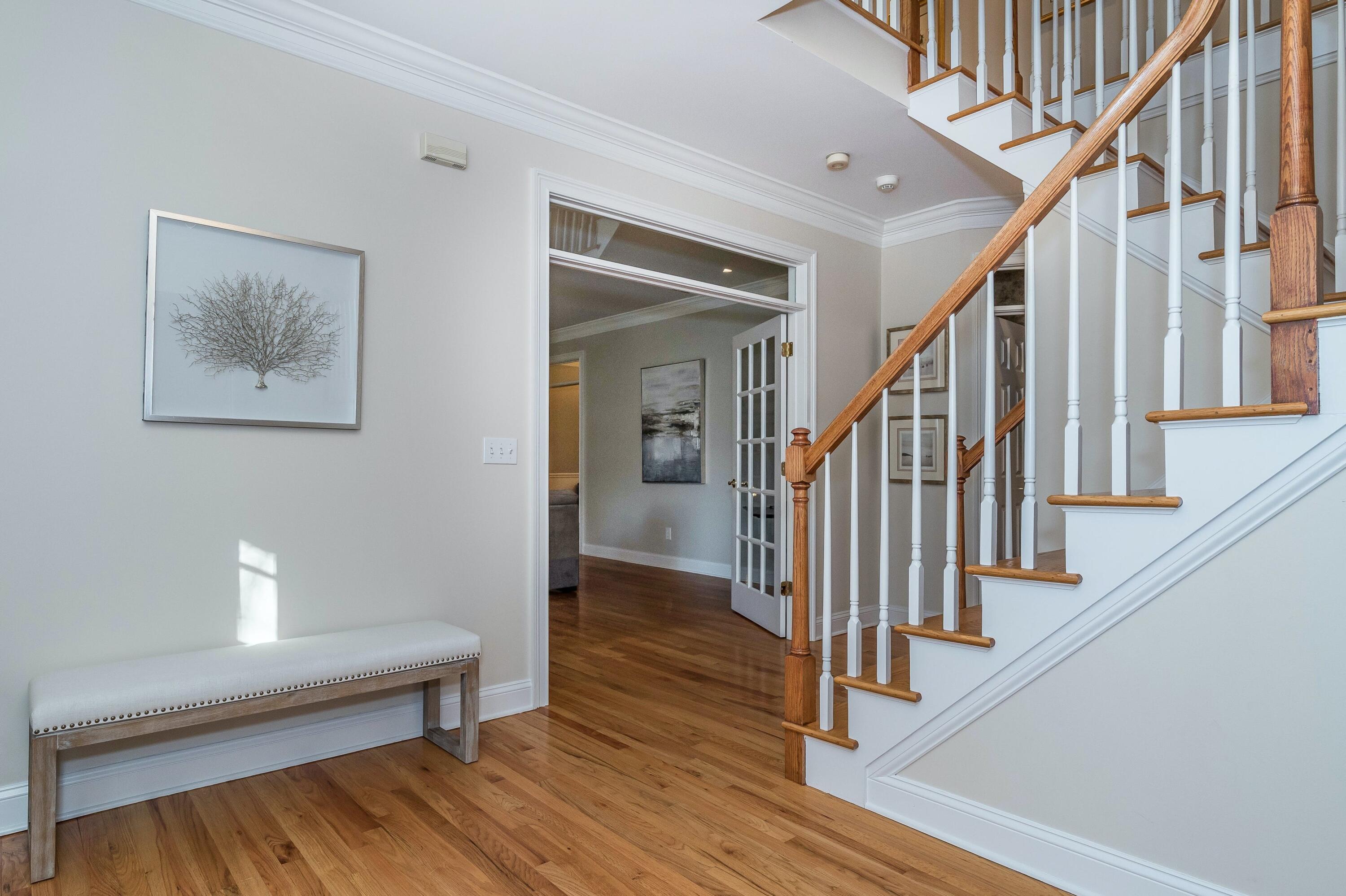 3 Fresh Meadows Lane Darien, CT 06820 - Photo 6 of 39 a view of staircase with wooden floor and a rug