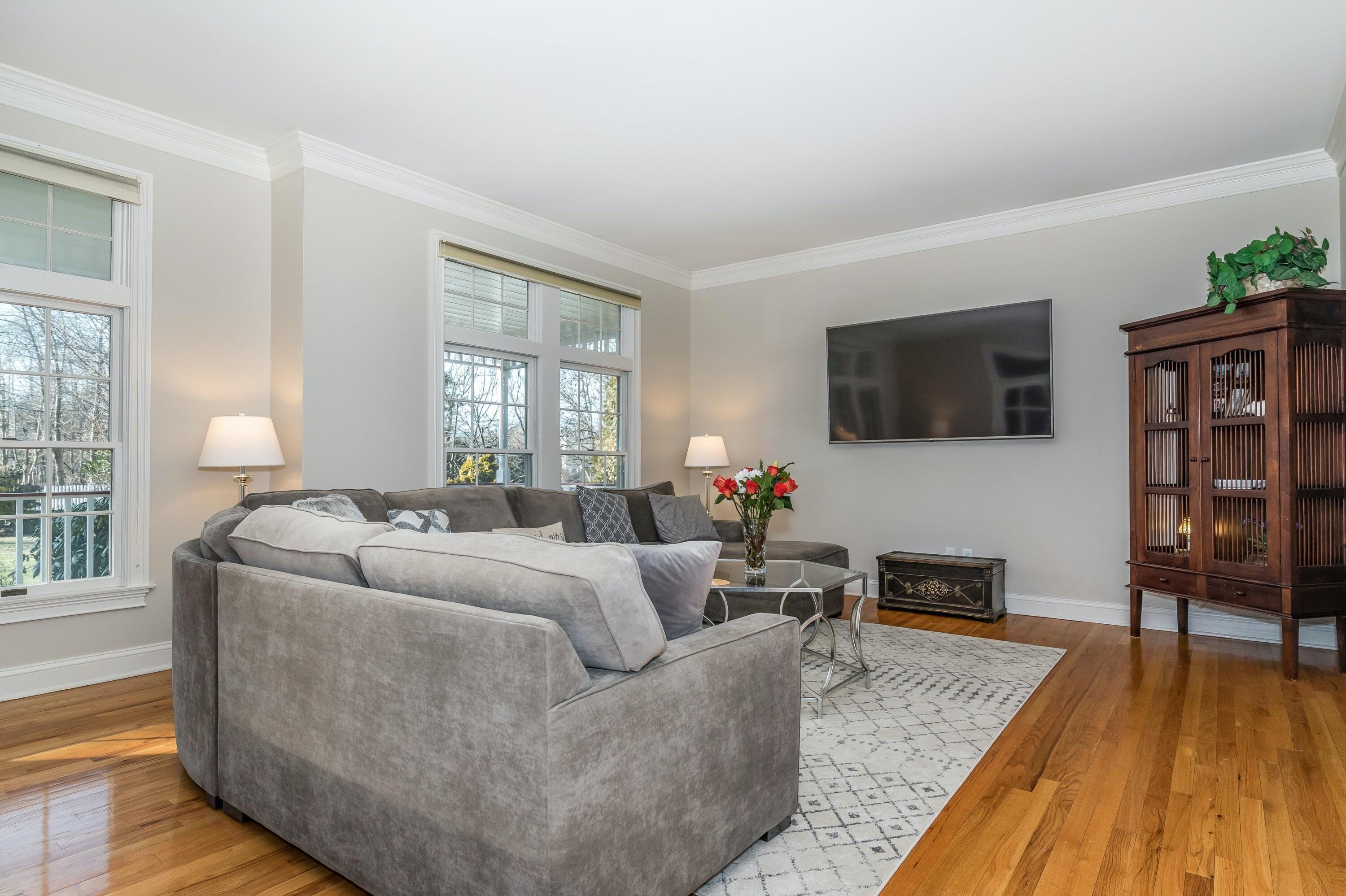 3 Fresh Meadows Lane Darien, CT 06820 - Photo 8 of 39 a living room with furniture and a flat screen tv