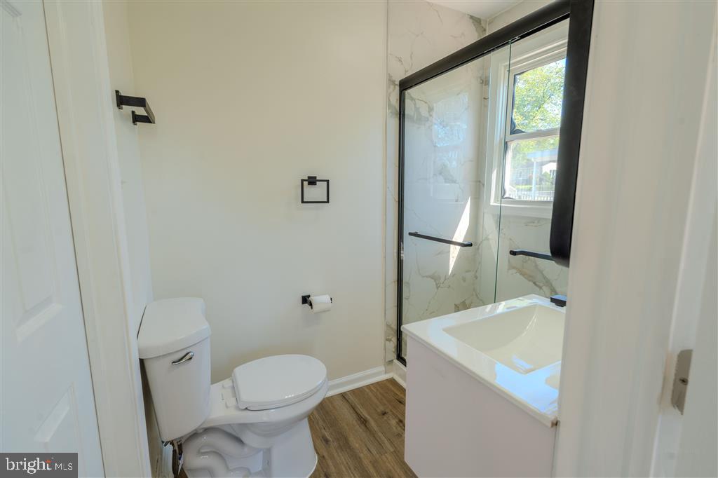 12324 Centerhill Street Silver Spring, MD 20902 - Photo 15 of 24 a bathroom with a toilet and a sink