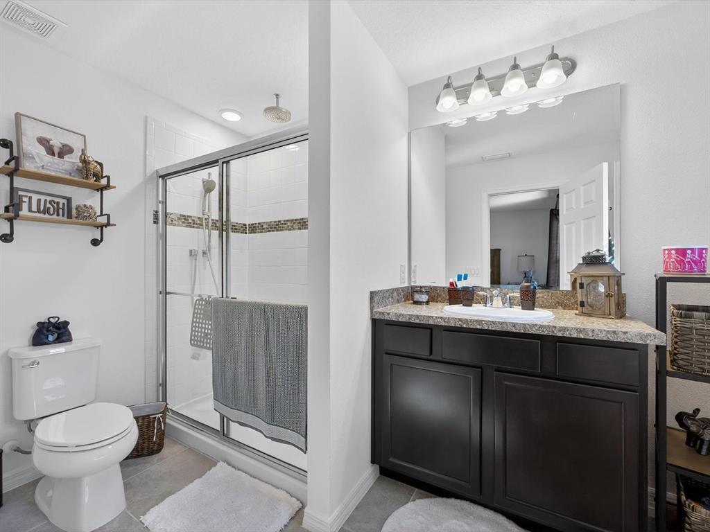 439 Annabelle Way Davenport, FL 33837 - Photo 17 of 31 a bathroom with a sink toilet and shower
