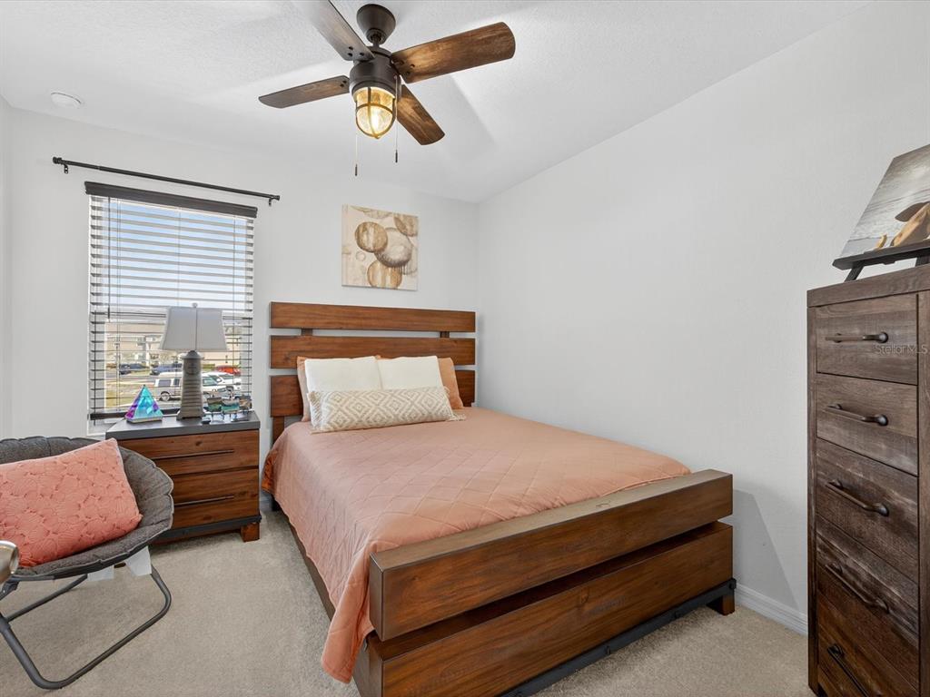 439 Annabelle Way Davenport, FL 33837 - Photo 18 of 31 a bedroom with a bed and window