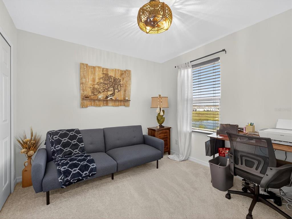 439 Annabelle Way Davenport, FL 33837 - Photo 21 of 31 a living room with furniture and a window