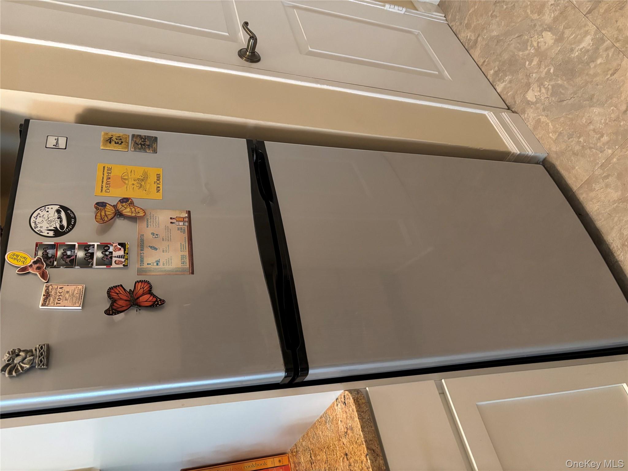 430 East 85th Street, Unit 6B Manhattan, NY 10028 - Photo 5 of 9 a white refrigerator freezer sitting inside of a kitchen