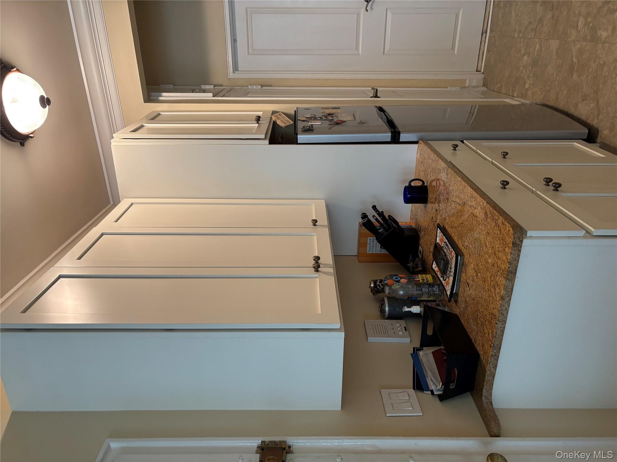 430 East 85th Street, Unit 6B Manhattan, NY 10028 - Photo 6 of 9 a kitchen with stainless steel appliances granite countertop a sink stove and refrigerator