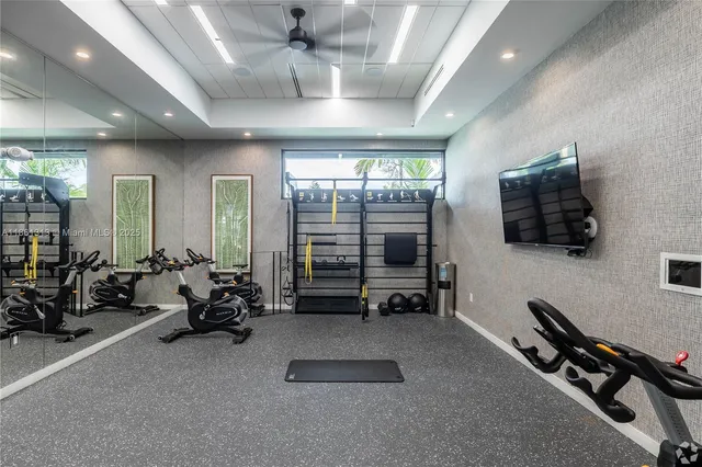 a room with gym equipment and a large window