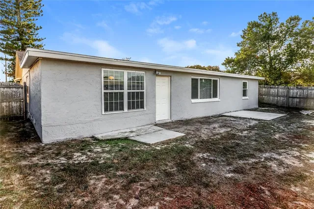 a house with trees in the background