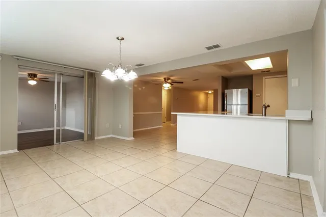 a view of a hallway with a chandelier